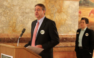 Photo by Stephen Koranda/KPR- Duane Goossen of the Kansas Center for Economic Growth and Annie McKay of Kansas Action for Children on Wednesday announced a tax overhaul proposal. The plan would undo some tax cuts made in recent years by raising the top income tax rate and reinstate income taxes on hundreds of thousands of businesses.