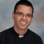 Catholic priest charged in Kansas with child sex crimes