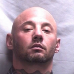Police: Kan. woman hid during burglary, suspect jailed