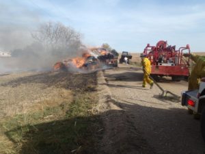 Several bales of hay were destroyed and the trailer hauling them was extensively damaged by this fire Tuesday afternoon (Photos: Saline County Sheriff's Office)