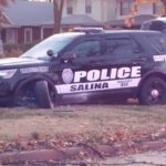 Damaged Salina Patrol unit in yard of home on southeast corner of Wilson and Santa Fe.