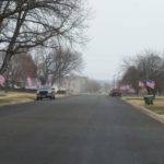 American flags fly in the 900 block of E. Claflin remembering the 75th anniversary of the Attack on Pearl Harbor. 