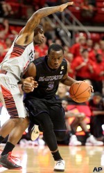 Kansas State's Martavious Irving drives against Texas Tech's Daylen Robinson during an NCAA college basketball game in Lubbock, Texas, Tuesday, Feb. 5, 2013. (AP Photo/Lubbock Avalanche-Journal, Zach Long)