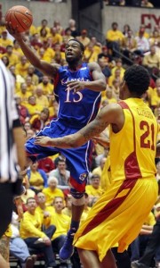 Kansas guard Elijah Johnson (15) shoots against Iowa State's Will Clyburn (21) during the first half of an NCAA college basketball game, Monday, Feb. 25, 2013, in Ames, Iowa. Johnson scored 39 points in their 108-96 overtime win. (AP Photo/Justin Hayworth)