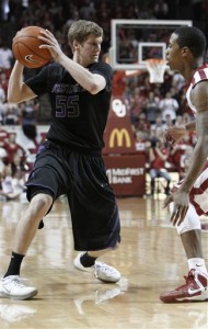 Kansas State guard Will Spradling, left, goes to the basket around Oklahoma guard Buddy Hield during the first half of an NCAA college basketball game in Norman, Okla., Saturday, Feb. 2, 2013. Kansas State won 52-50. (AP Photo/Alonzo Adams)