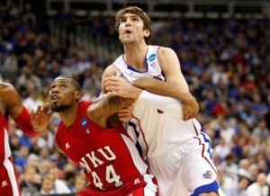 KANSAS CITY, MO - MARCH 22: George Fant #44 of the Western Kentucky Hilltoppers boxes out Jeff Withey #5 of the Kansas Jayhawks in the first half during the second round of the 2013 NCAA Men's Basketball Tournament at the Sprint Center on March 22, 2013 in Kansas City, Missouri. (Photo by Ed Zurga/Getty Images)