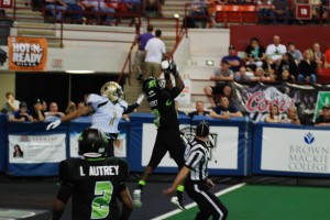 DeWayne Autrey shown making one of three interceptions versus Lincoln. (Photo Courtesy of Aaron's Photography/Salina Bombers