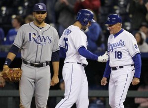 Kansas City Royals Eric Hosmer (35) and first base coach Rusty Kuntz (18) react after Hosmer’s hit tied in the sixth inning of Wednesday’s game at Kauffman Stadium in Kansas City. The Royals won 9-8.