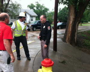 Hays Police Chief Don Scheibler talks with other first responders Monday afternoon.