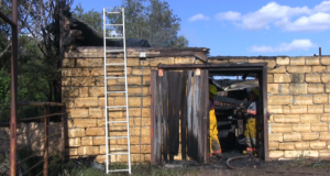 Limestone walls of 125-year-old barn still stand after Tuesday’s fire.