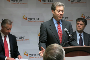 Kansas Gov. Sam Brownback thanks OptumRX, an Overland Park pharmacy company, for donating more than $10 million in unused medications to safety-net clinics across the state.-photo by Elle Moxley