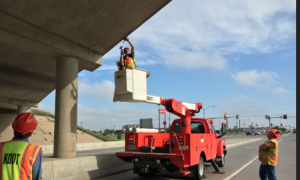 KDOT crews work early Friday morning on I-70 overpass in Hays