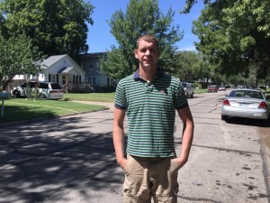Jerry Alkire stands on N. 10th street just a few yards from where was struck by gunfire on August 7th while coming to the aid of a shooting victim (Photo by Terry Tebrugge/Salina Post)