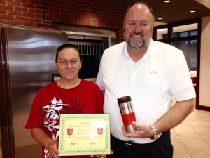 Bank VI President Tom Wilbur presents Billie Jo Glavin with her Hero of the Week award