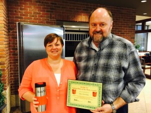 Bank VI President Tom Wilbur presents Nicci Novotny with her Hero of the Week award