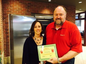 Bank VI President Tom Wilbur presents Amanda Otto with her Hero of the Week award
