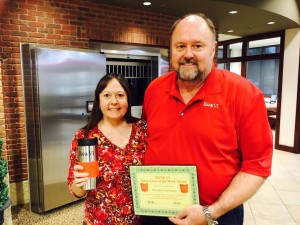 Bank VI President Tom Wilbur presents Kristina Litchman with her Hero of the Week award