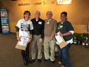 Steve Kmetx, Executive Director of the Salina Rescue Mission stands with three food drive volunteers at the Dillons at Cloud & Ohio Friday afternoon (Photo by Terry Tebrugge/Salina Post) 