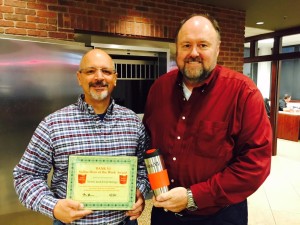BANK VI President Tom Wilbur presents Norm Jennings with the Hero of the Week award. Not Pictured: Jen Jennings