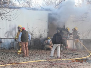 Rural fire crews work to extinguish a mobile home fire in Brookville early Sunday morning (Photos: Saline County Sheriff)