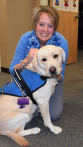Amy Hawley, Procter's principal, with Milli, the school's certified professional therapy dog. CREDIT TAMMY WORTH / HEARTLAND HEALTH MONITOR