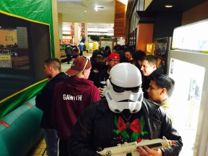 Star Wars Bryce Korf wears a Storm Trooper helmet while standing in line to see Star Wars: The Force Awakens on Thursday.