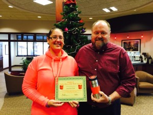 BANK VI President Tom Wilbur presents Jennifer Fisk with her Hero of the Week award