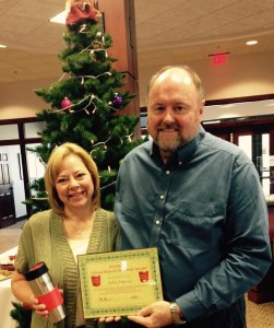 BANK VI President Tom Wilbur presents Kelley Hulteen with her Hero of the Week award