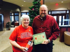 BANK VI President Tom Wilbur presents Vivian Kochanowski with her Hero of the Week award