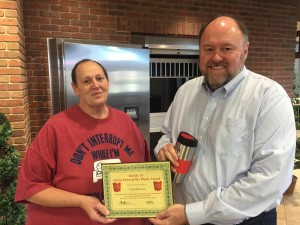 BANK VI President Tom Wilbur presents Todd Brown with his Hero of the Week award