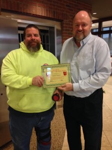 BANK VI President Tom Wilbur presents James Trepoy with his Hero of the Week award