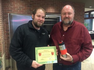 BANK VI President Tom Wilbur presents Nathan McClanahan with his Hero of the Week award