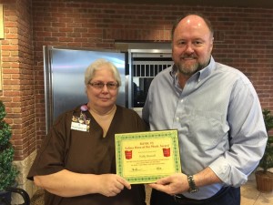 BANK VI President Tom Wilbur presents Polly Howell with her Hero of the Week award.