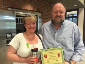 BANK VI President Tom Wilbur presents Cari Harpster with her Hero of the Week Award