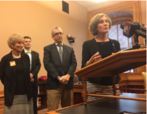 Members of a coalition asking Kansas Gov. Sam Brownback to convene a meeting on gun violence include (left to right) Judy L. Sherry of Grandparents Against Gun Violence; Dennis Dobson of Heeding God's Call; Rabbi Moti Rieber of Kansas Interfaith Action; and Rep. Barbara Bollier, a Mission Hills Republican. CREDIT JIM MCLEAN / HEARTLAND HEALTH MONITOR