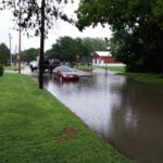 Car stalled out in high water on Saline Street in Lindsborg.