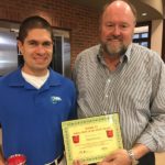 Tom Wilbur, President of Bank VI presents Daniel Craig with The Hero of The Week Award.