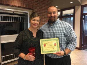 Chris Baker, BANK VI Executive Vice President and Senior Lender, presents Katie Herwig with her Hero of the Week Award