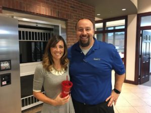 Chris Baker, BANK VI Executive Vice President and Senior Lender, presents Katie Jones with her Hero of the Week Award