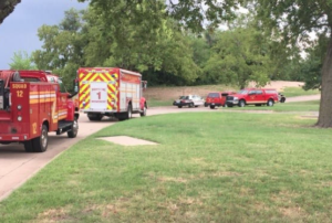 Emergency crews work to recover a body from the Arkansas River in south Wichita- photo courtesy KAKE