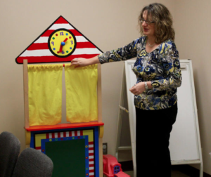 Julie Boydston explains how toys can serve as tools for student counselors at the University of Kansas Child and Family Services Clinic in Lawrence. The clinic provides counseling services to children and their families on a sliding scale based on income. ANDY MARSO / HEARTLAND HEALTH MONITOR