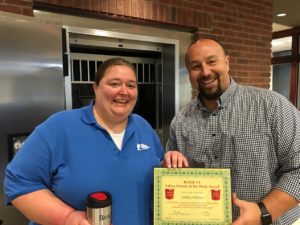 Chris Baker, BANK VI Executive Vice President and Senior Lender, presents Amber Shelton with her Hero of the Week Award