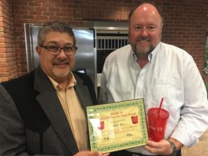 Tom Wilbur, president of BANK VI, presents Jim DuBois with his BANK VI Hero of the Week Award