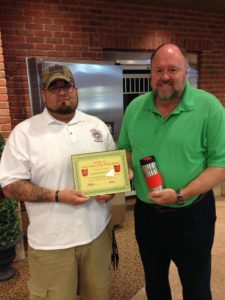 BANK VI President Tom Wilbur presents Johnathan Sotomayor with his Hero of the Week Award