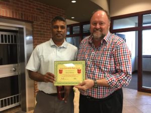 Tom Wilbur, President of BANK VI, presents Selvan Raman with his Hero of the Week Award