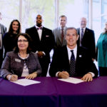Representatives from Kansas State University's Polytechnic Campus and Kansas Wesleyan University sign an agreement July 11 to enable unmanned aircraft systems students at Kansas State Polytechnic and emergency management students at Kansas Wesleyan to cross-register and earn a minor in the other institution's program. Front row, from left: Verna Fitzsimmons, dean and CEO of Kansas State Polytechnic, and Matt Thompson, president of Kansas Wesleyan University. Back row, from left: Bernie Botson, deputy director of emergency management for Saline County; Kendy Edmonds, junior in Kansas State Polytechnic's UAS program; Lonnie Booker Jr., director of Kansas Wesleyan University's emergency management program; Kurt Carraway, executive director of Kansas State Polytechnic's UAS program; Bill Backlin, Kansas Wesleyan University's interim provost; and Alysia Starkey, associate dean of undergraduate studies at Kansas State Polytechnic.
